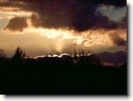 Západ slunce nad lesem...