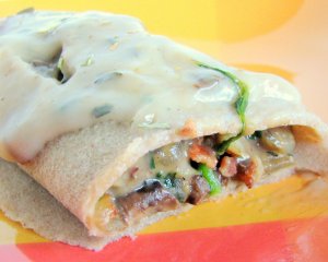 Recept online: Zapečené palačinky se špenátem, slaninou a žampiony: Palačinky plněné okořeněnou směsí špenátu, žampionů a osmažené slaniny, zapečené